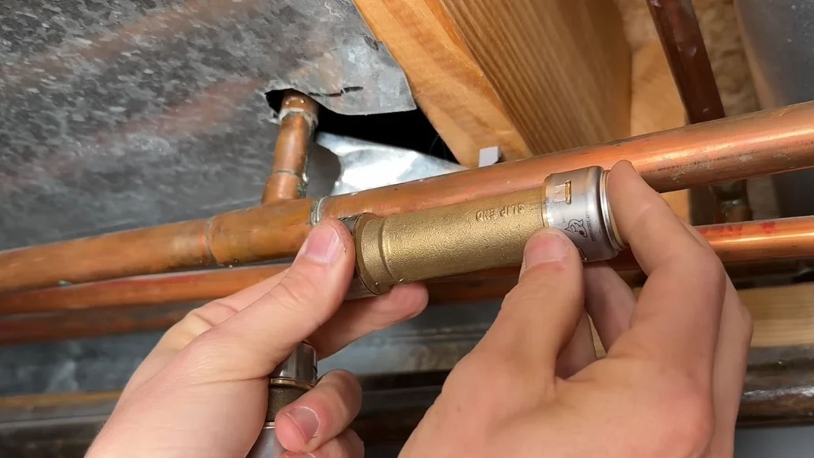 Plumber repairing a burst pipe in a Naples, FL home