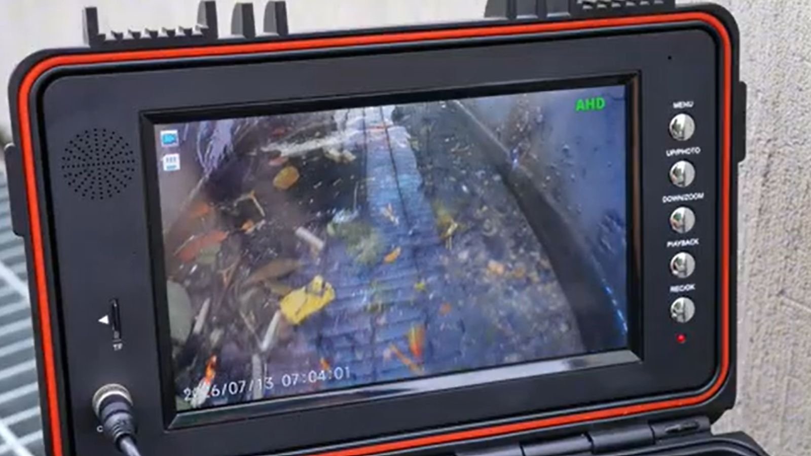 Sewer inspection camera and monitor showing pipe interior